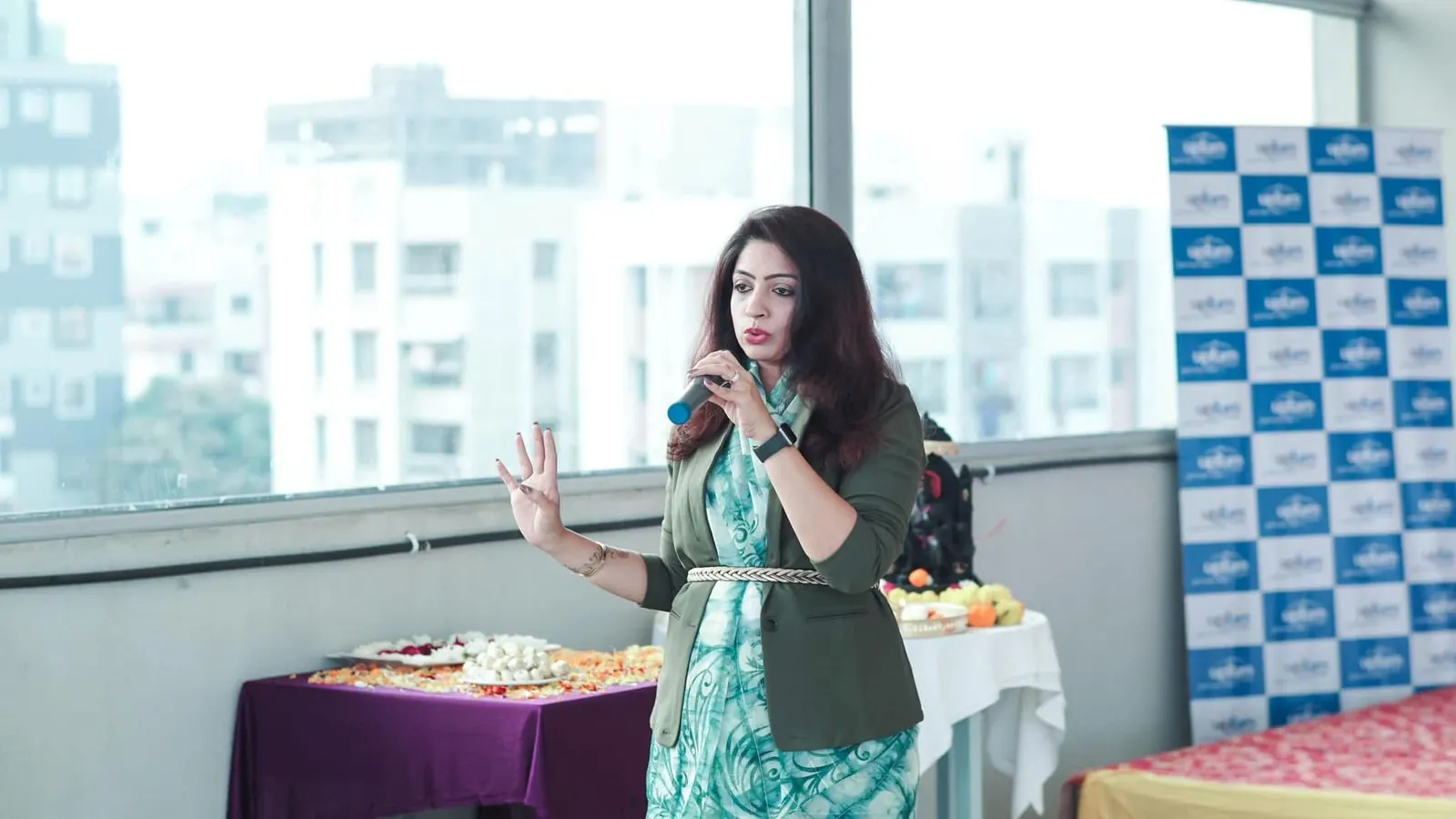 Sayali speaking on stage